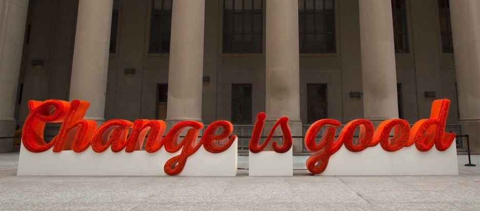 sculpture that says Change is Good made of red straws