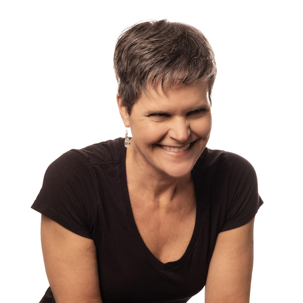 professional portrait of mature woman in black shirts smiling